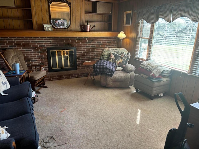 5398 Marietta Rd SE, New Lexington, OH 43764 - carpeted living area featuring wood walls and a fireplace