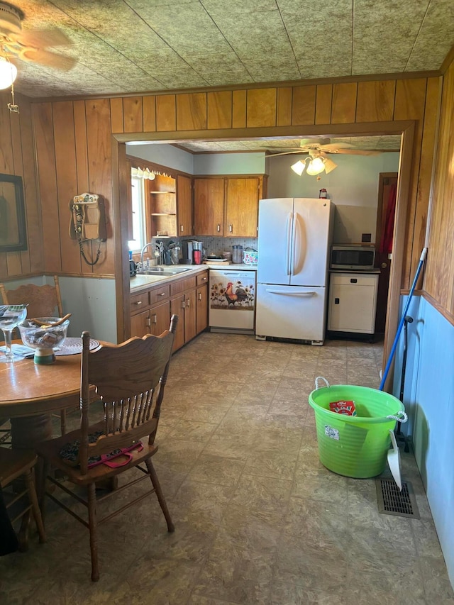 5398 Marietta Rd SE, New Lexington, OH 43764 - dining space with wood walls, visible vents, and a ceiling fan