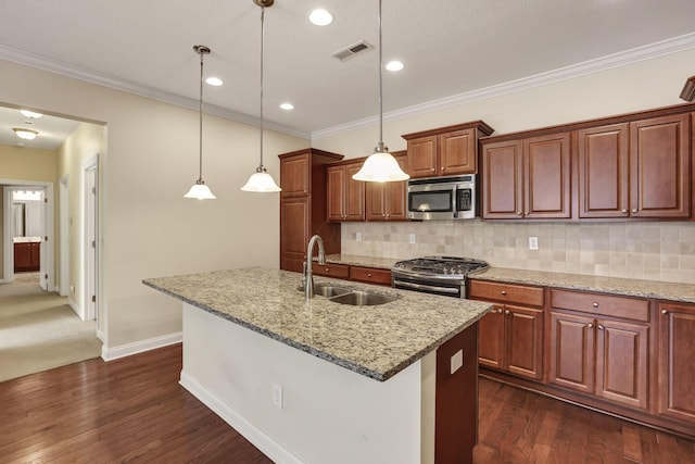 kitchen with a sink, stainless steel appliances, dark wood finished floors, and visible vents
