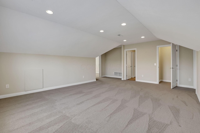 bonus room featuring visible vents, carpet, recessed lighting, and lofted ceiling