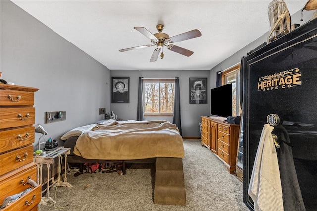 bedroom with baseboards, a ceiling fan, and light carpet