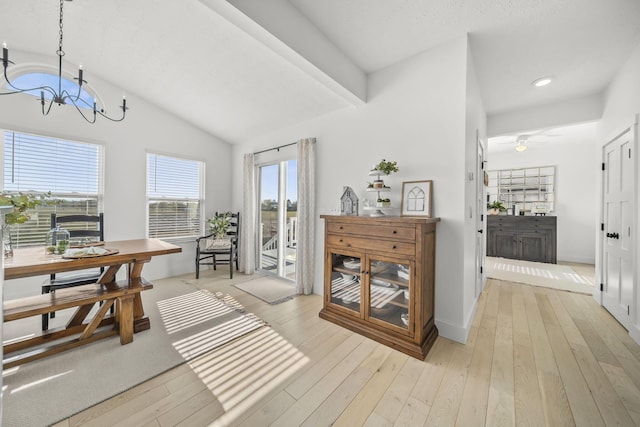 interior space featuring recessed lighting, an inviting chandelier, vaulted ceiling, and light wood-type flooring