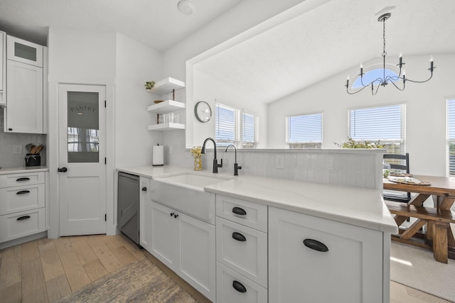 kitchen with open shelves, an inviting chandelier, a sink, backsplash, and stainless steel dishwasher