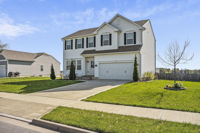 traditional-style house with a garage, fence, driveway, and a front lawn