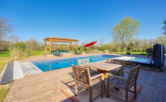 outdoor pool with a pergola, an in ground hot tub, and a patio area
