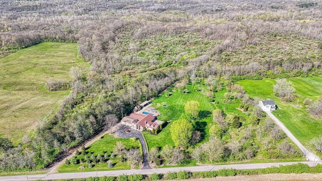 aerial view featuring a wooded view