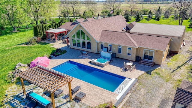 outdoor pool with a yard, a pergola, an in ground hot tub, and entry steps