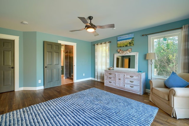 bedroom featuring a ceiling fan, baseboards, and wood finished floors