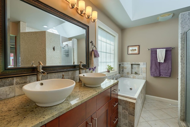 full bath with a sink, double vanity, a stall shower, and a bath