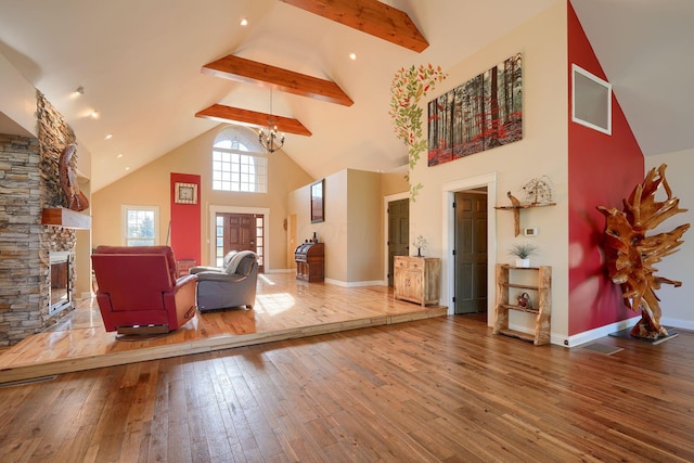sitting room featuring a fireplace, high vaulted ceiling, baseboards, beamed ceiling, and hardwood / wood-style flooring