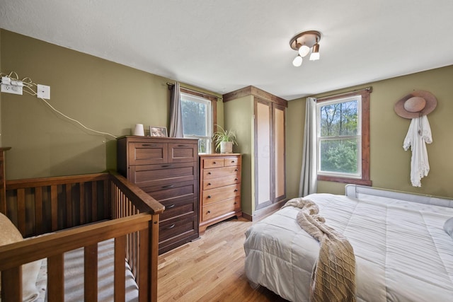 bedroom with light wood-style flooring