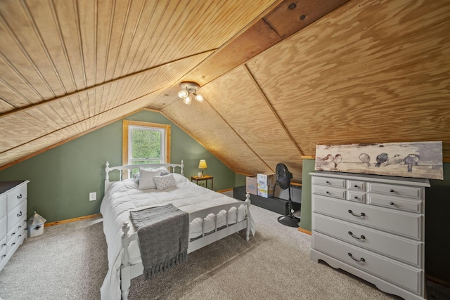 carpeted bedroom featuring baseboards, vaulted ceiling, and wooden ceiling
