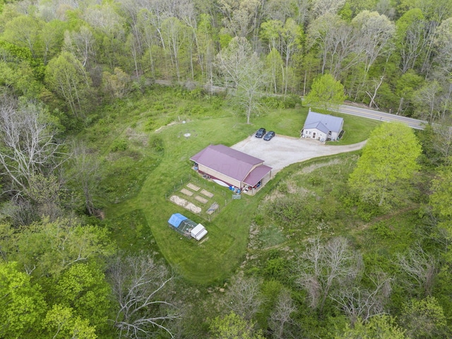 drone / aerial view featuring a forest view