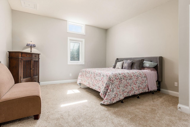 carpeted bedroom with baseboards