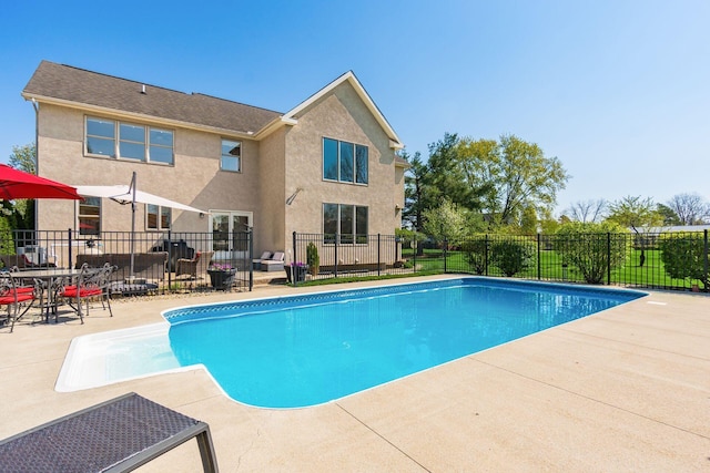view of pool featuring a patio, a fenced in pool, and fence