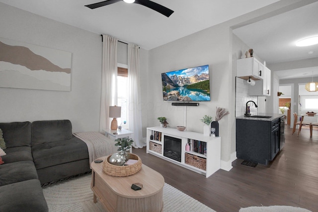 living room featuring ceiling fan and wood finished floors