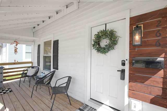 doorway to property featuring covered porch