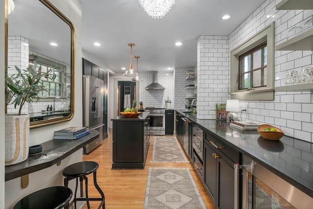 152 S Stanwood Rd, Columbus, OH 43209 - kitchen with dark countertops, appliances with stainless steel finishes, tasteful backsplash, and wall chimney exhaust hood