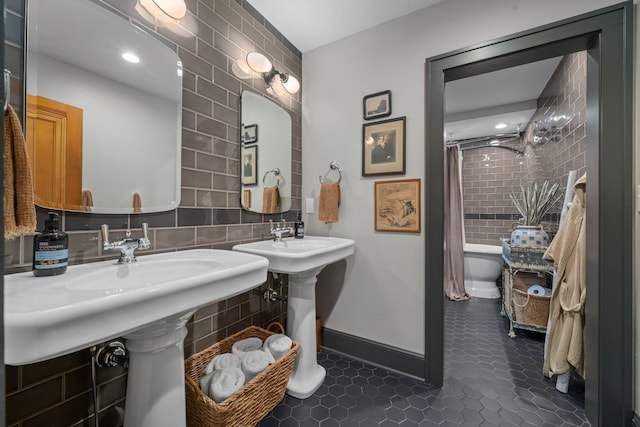 152 S Stanwood Rd, Columbus, OH 43209 - full bath with tile walls, baseboards, tile patterned flooring, and curtained shower
