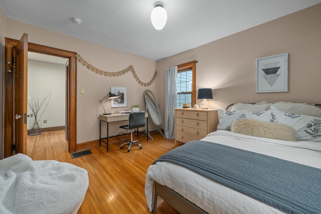 152 S Stanwood Rd, Columbus, OH 43209 - bedroom with baseboards, visible vents, and light wood-style flooring