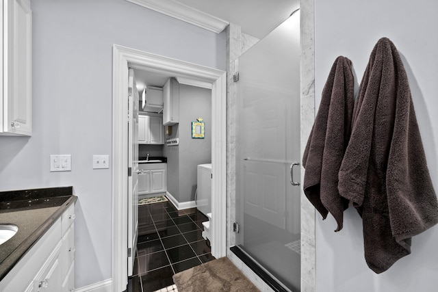 bathroom with toilet, vanity, a shower stall, and tile patterned flooring