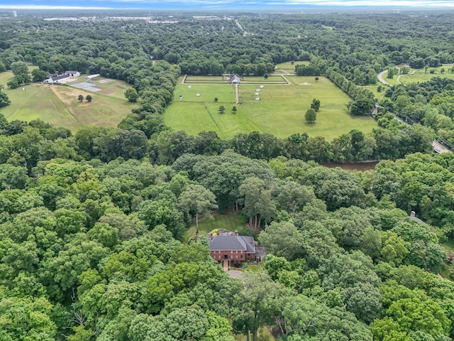 birds eye view of property with a rural view and a wooded view