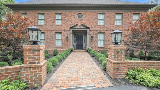 view of front of home featuring brick siding