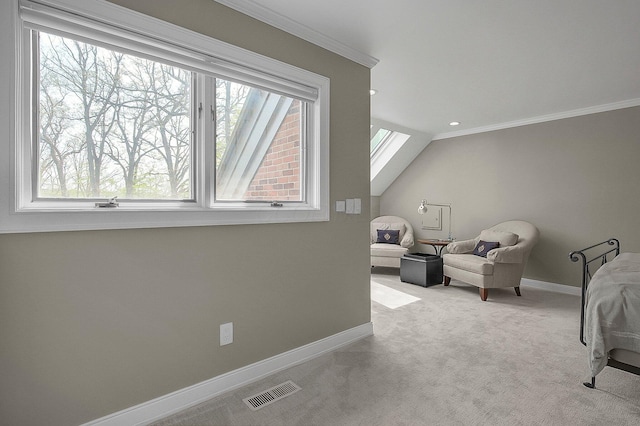 sitting room with plenty of natural light, ornamental molding, baseboards, and visible vents