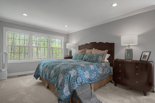 bedroom featuring visible vents, crown molding, baseboards, recessed lighting, and light colored carpet