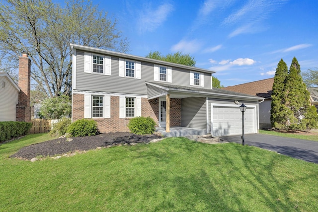 7847 Maplecreek Ct, Powell, OH 43065 - view of front facade with fence, a front yard, driveway, and brick siding