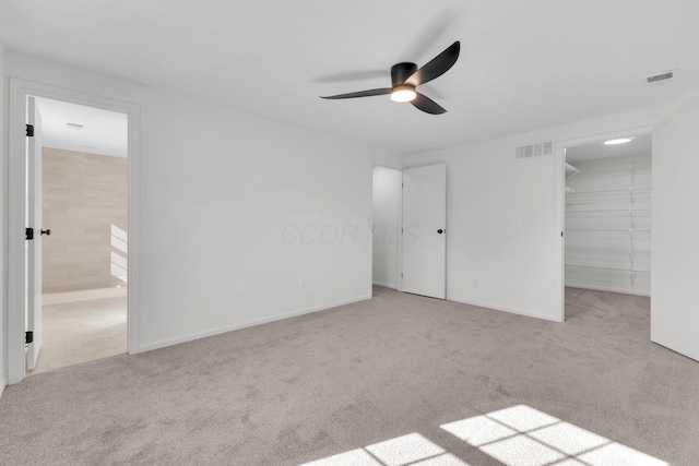 7847 Maplecreek Ct, Powell, OH 43065 - unfurnished bedroom featuring ensuite bathroom, visible vents, carpet, and a spacious closet