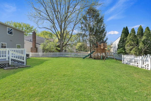 7847 Maplecreek Ct, Powell, OH 43065 - view of yard with a fenced backyard, a playground, and a deck