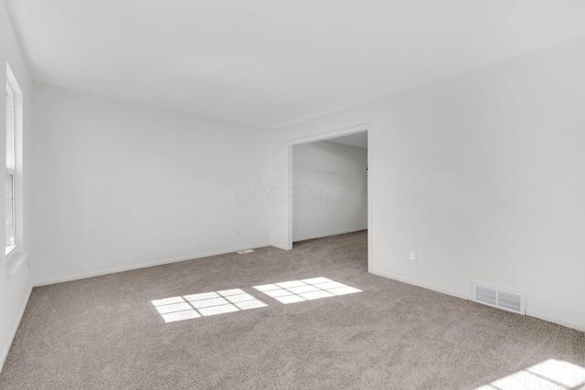 7847 Maplecreek Ct, Powell, OH 43065 - empty room featuring visible vents, carpet, and baseboards