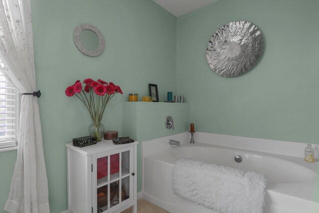 bathroom with a garden tub