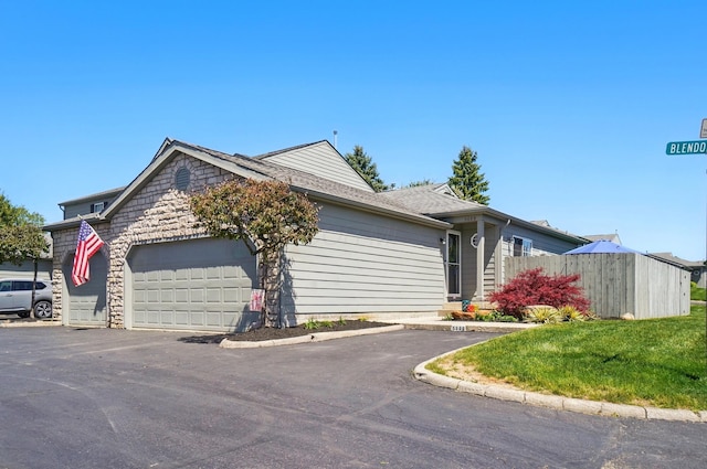 5688 Blendonridge Dr Unit 93E, Columbus, OH 43230 - ranch-style home featuring fence, roof with shingles, and a garage