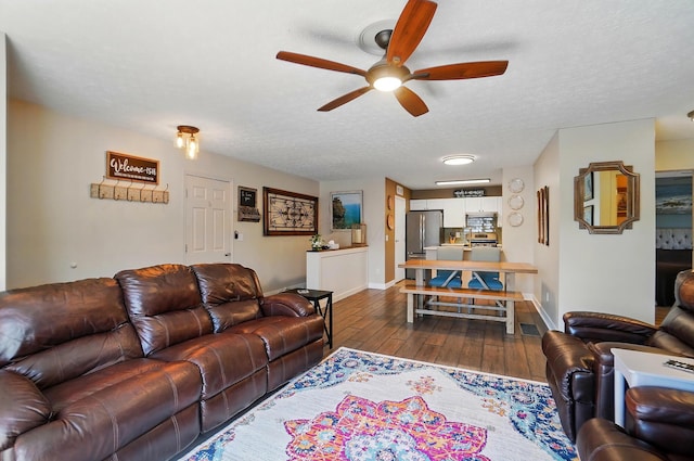 5688 Blendonridge Dr Unit 93E, Columbus, OH 43230 - living room with a ceiling fan, baseboards, dark wood finished floors, and a textured ceiling