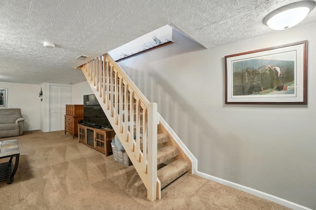 5688 Blendonridge Dr Unit 93E, Columbus, OH 43230 - staircase with carpet flooring, a textured ceiling, visible vents, and baseboards