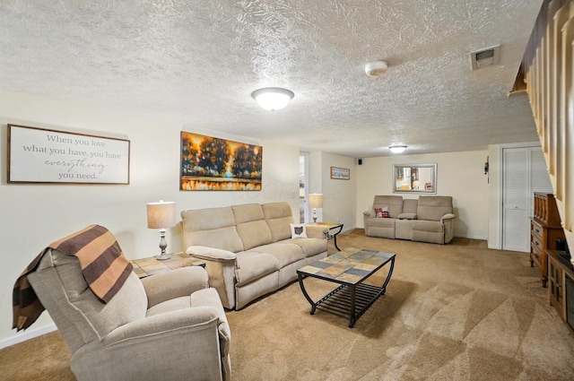 5688 Blendonridge Dr Unit 93E, Columbus, OH 43230 - carpeted living room featuring a textured ceiling, visible vents, and baseboards