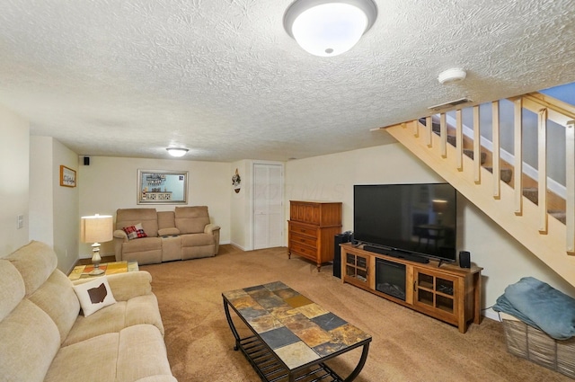 5688 Blendonridge Dr Unit 93E, Columbus, OH 43230 - carpeted living room featuring a textured ceiling and stairway