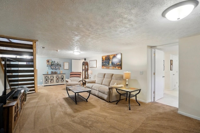 5688 Blendonridge Dr Unit 93E, Columbus, OH 43230 - living area with carpet floors, stairs, a textured ceiling, and baseboards