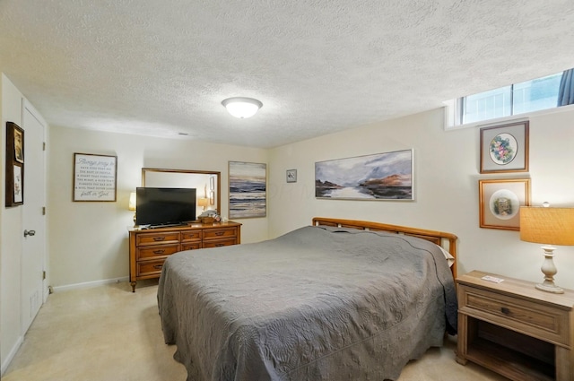 5688 Blendonridge Dr Unit 93E, Columbus, OH 43230 - bedroom featuring baseboards, a textured ceiling, and light carpet