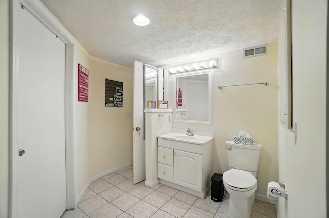 5688 Blendonridge Dr Unit 93E, Columbus, OH 43230 - bathroom featuring visible vents, tile patterned flooring, vanity, toilet, and a textured ceiling
