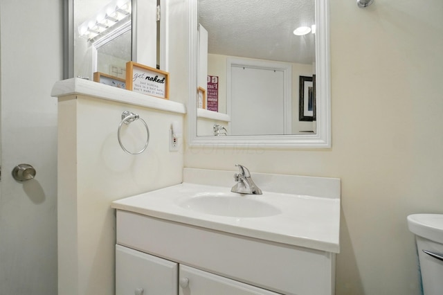 5688 Blendonridge Dr Unit 93E, Columbus, OH 43230 - bathroom featuring toilet, a textured ceiling, and vanity