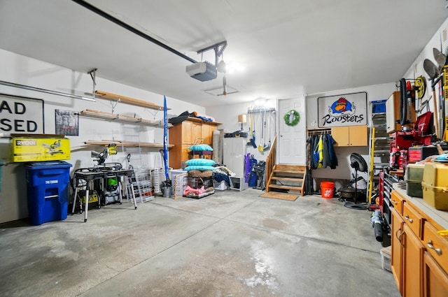 5688 Blendonridge Dr Unit 93E, Columbus, OH 43230 - garage featuring a workshop area and a garage door opener