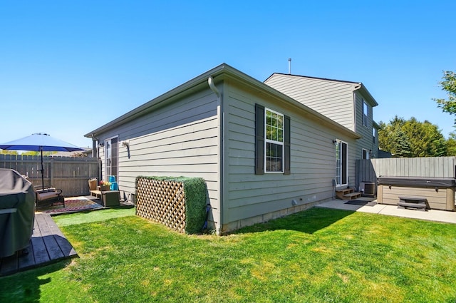5688 Blendonridge Dr Unit 93E, Columbus, OH 43230 - view of home's exterior with fence, a hot tub, an outdoor living space, a patio area, and central air condition unit