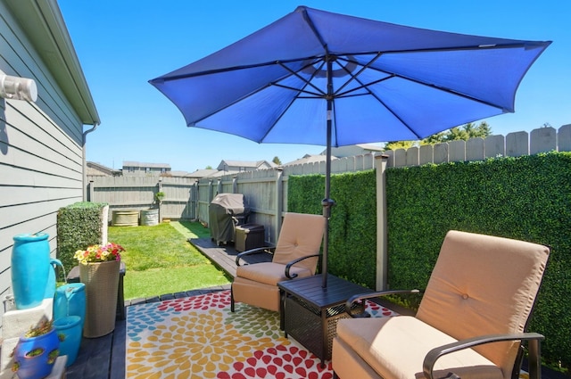 5688 Blendonridge Dr Unit 93E, Columbus, OH 43230 - view of patio / terrace with a fenced backyard and a grill