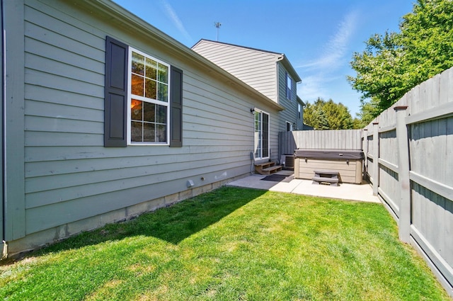 5688 Blendonridge Dr Unit 93E, Columbus, OH 43230 - view of yard featuring a fenced backyard, a hot tub, a patio area, and entry steps