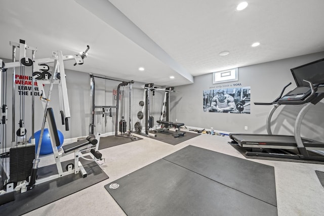 exercise room with recessed lighting
