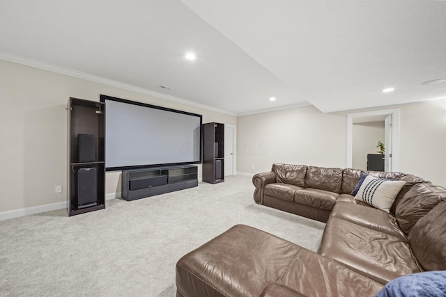 home theater room featuring baseboards, recessed lighting, crown molding, and light carpet