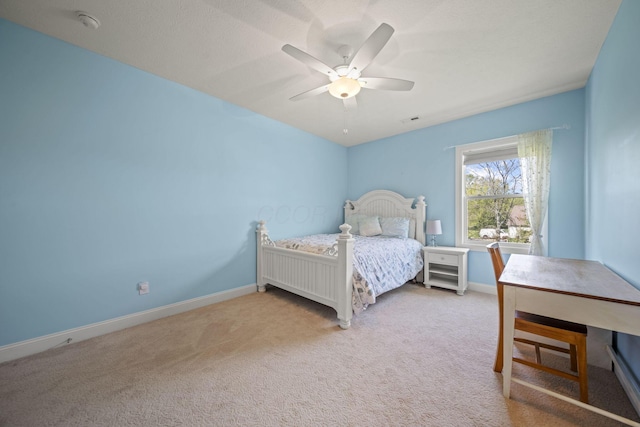 bedroom featuring a ceiling fan, baseboards, light colored carpet, and visible vents